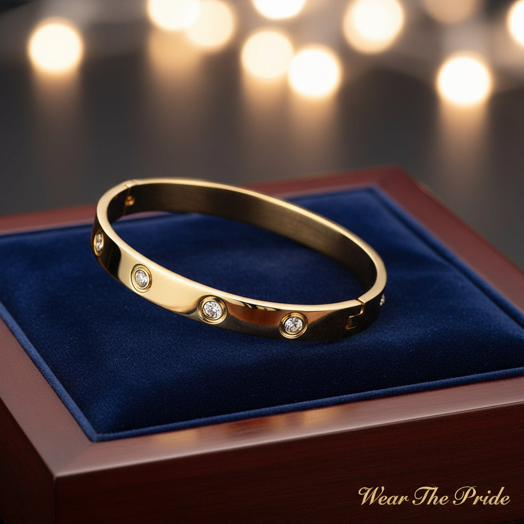 Gold bracelet with diamond accents on a white surface